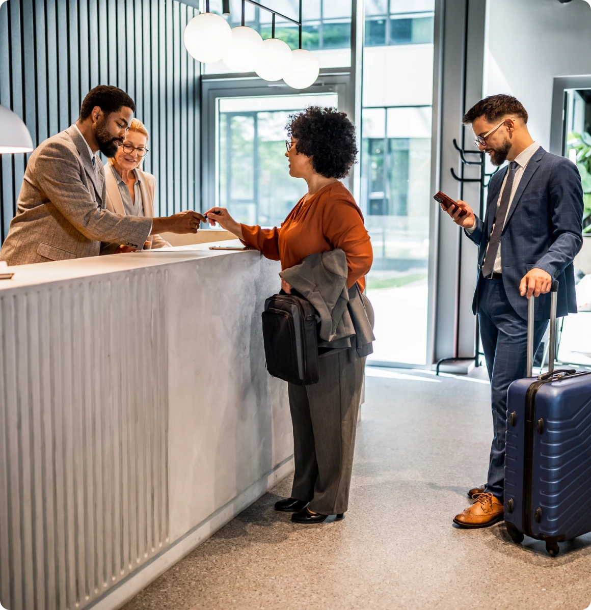 Guests checking in at hotel reception